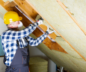 Builder installing installation in the roof