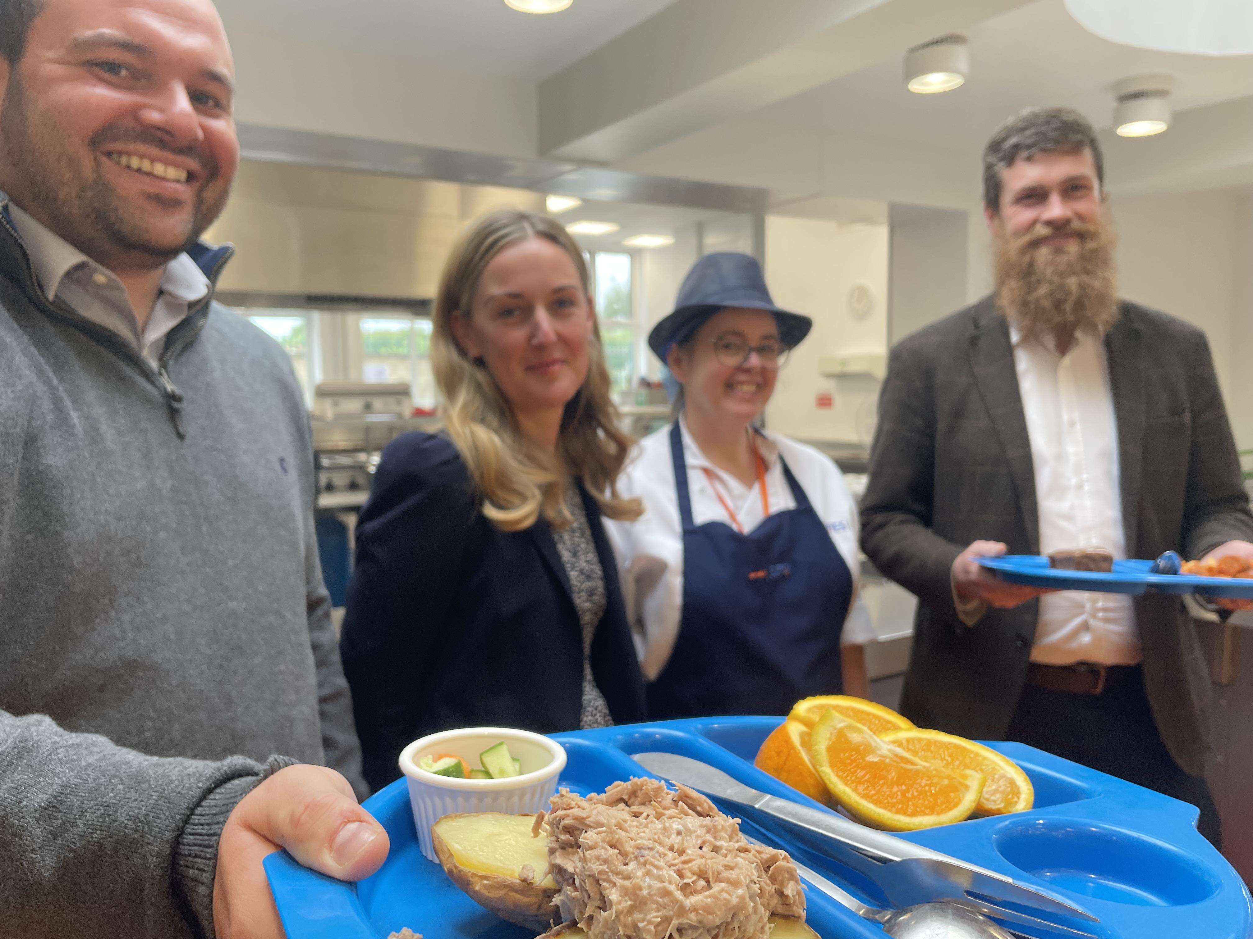 Cllr bob webb city of york council s executive member for children young people and education right celebrating the six month anniversary of the free school meals pilot at westfield primary community school with school staff