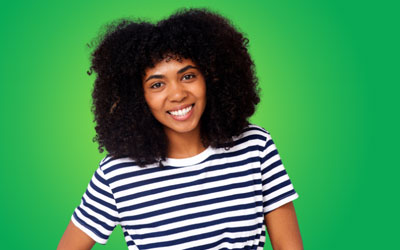 Health Trainers - Woman in stripey top, smiling