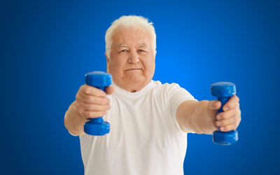 Health Trainers - Older man with white hair holding small gym weights