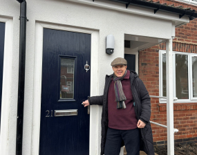 Man stands at doorway