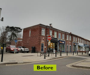 The side of the barbershop on Acomb Front Street without any paint