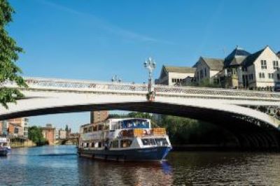 City Cruises blue boat sails in York