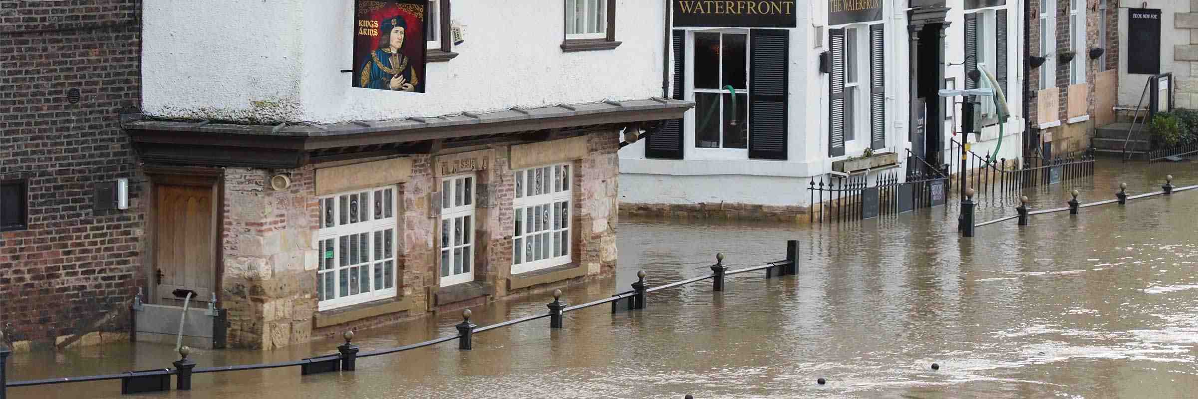 The Kings Arms pub with floodwater up to the windows