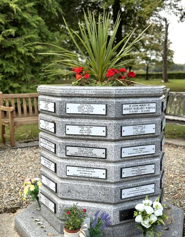Octagonal granite planter with memorial plaques