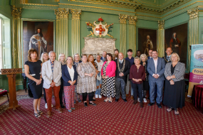 Group photo of foster carers honoured at awards ceremony by the civic party and young people they have cared for