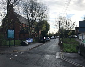 Parked and manoeuvring vehicles on Jubilee Terrace, which can cause conflict between pedestrians and cyclists