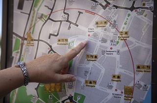 Pointing to a map of York city centre