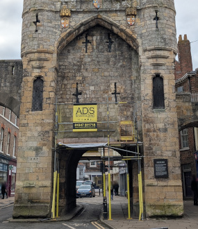 Monk Bar in York, shown with scaffolding to the northern and southern sides of the bar