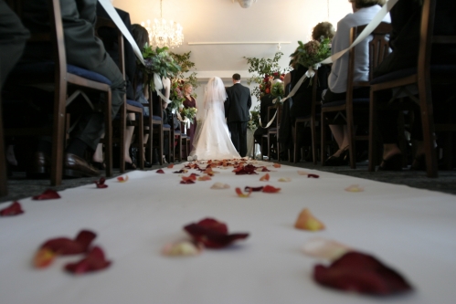 Wedding venue interior aisle and couple