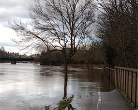 Localised flooding of the riverside path during river flood events
