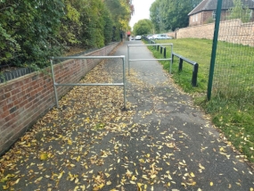 Existing barriers at the end of the riverside path route