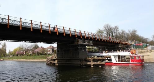 A pleasure boat sails under Scarborough bridge.