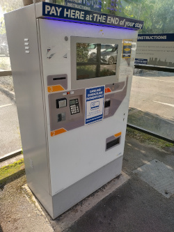 Car parking ticket machine in booth