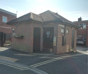 The toilet block has been refurbished and stands on a street corner