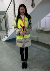 Chinese student Wennan poses with her litter picking equipment.