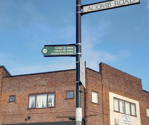 A new wayfinding sign pointing to Acomb Road as well as facilities and green spaces