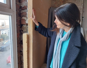 Cllr Jenny Kent inspects some insulation being installed in a home in York