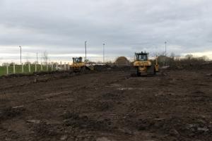 Bulldozers flatten the earth as work commences at York Community Stadium.