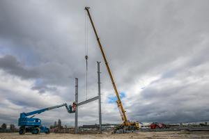 Cranes hold the framework in place during the building of the York Community Stadium.