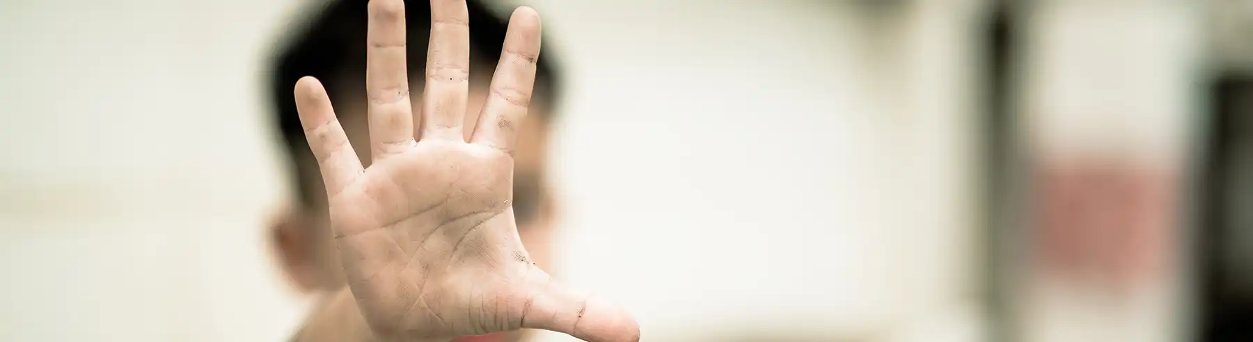 A boy's hand thrust forward towards the camera